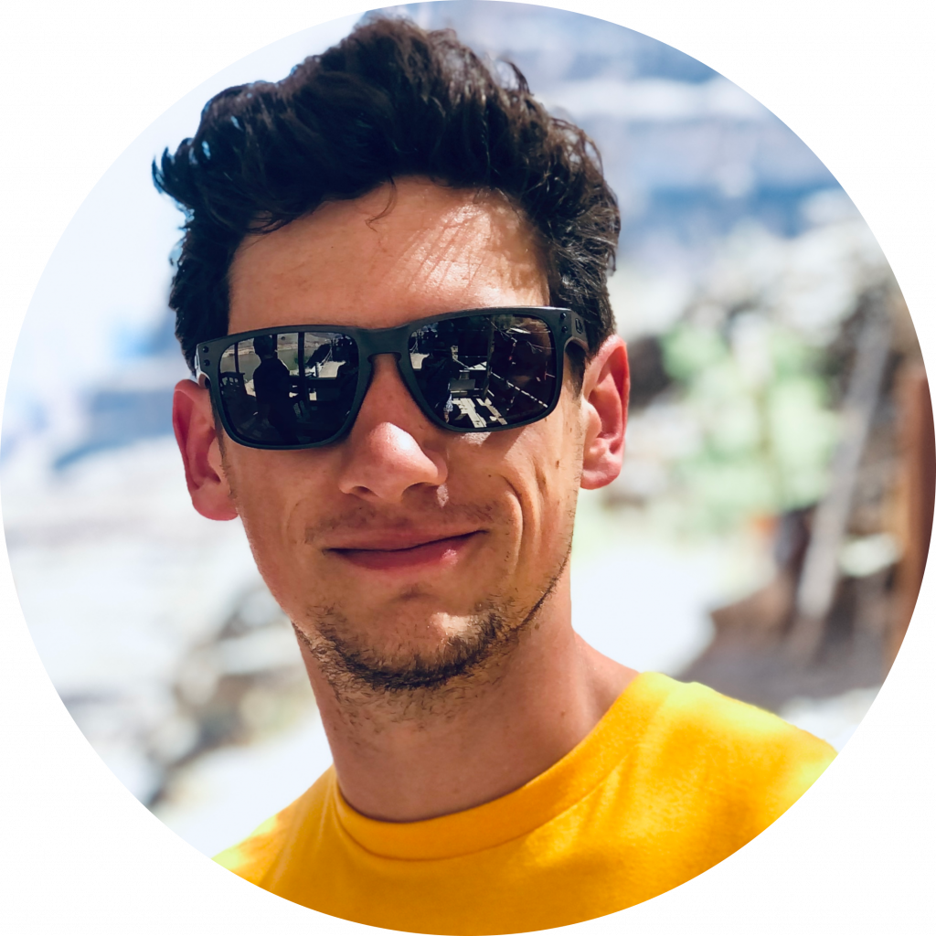 Dylan Smiling with sunglasses and yellow shirt